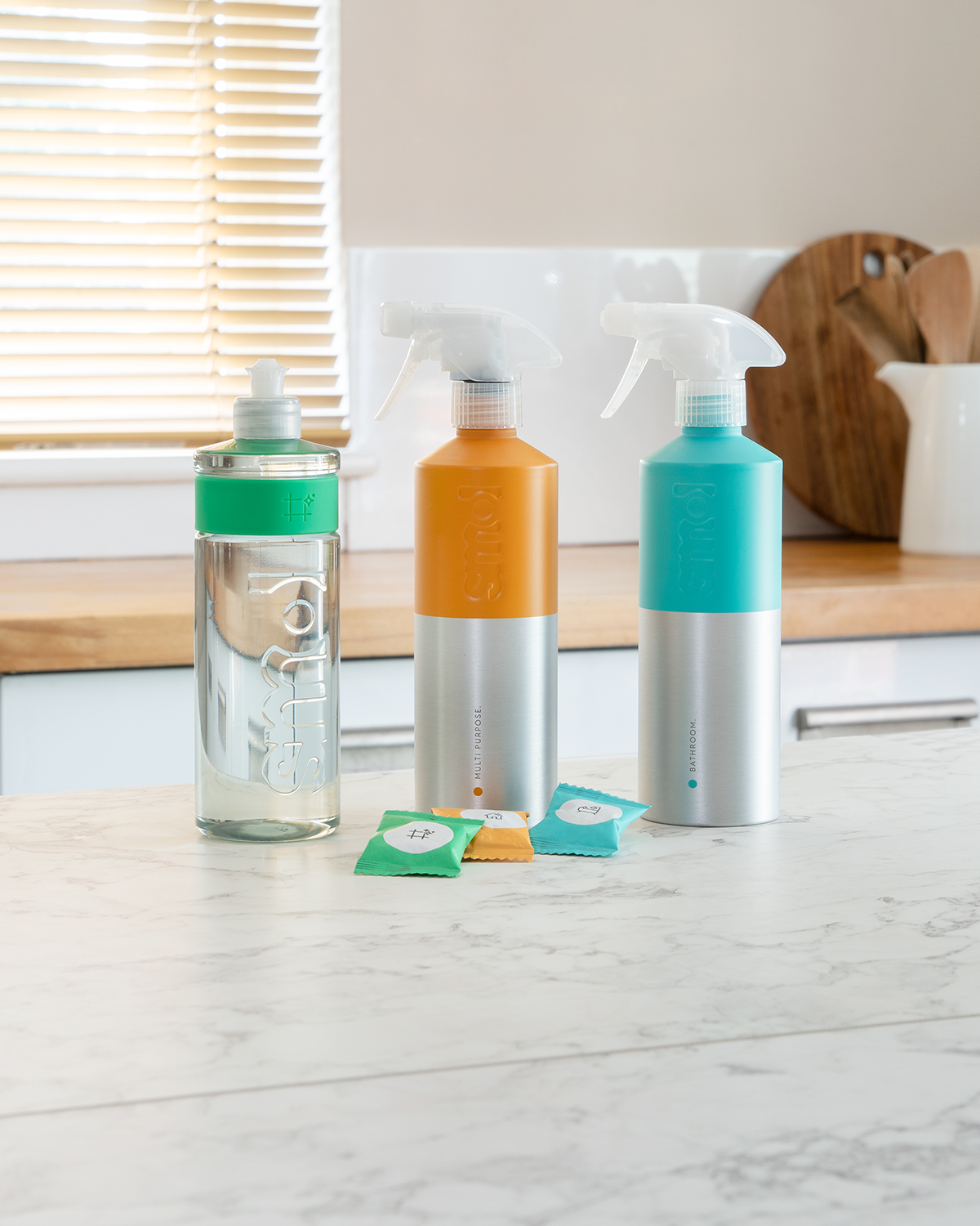smol floor cleaner, multi purpose spray and foaming bathroom spray on a kitchen counter