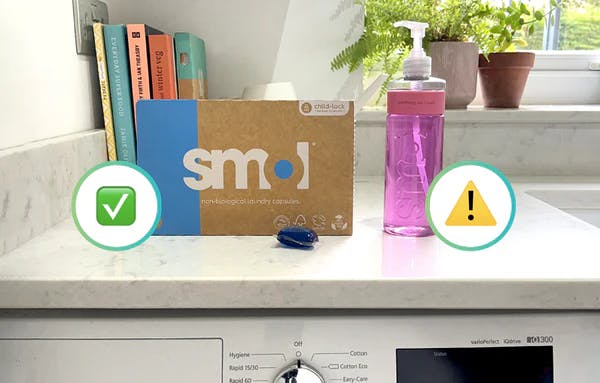 smol bio capsules and washing up liquid on a kitchen counter