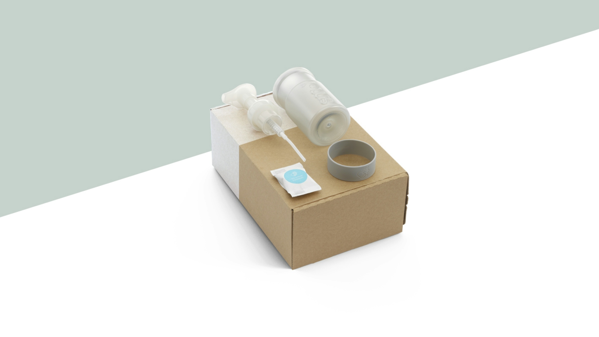 smol foaming handwash tablet and pump bottle on top of its cardboard packaging