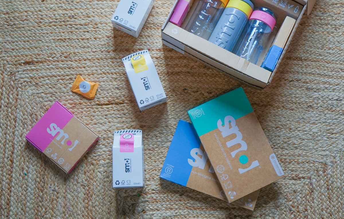 smol products laid out on a wooden floor