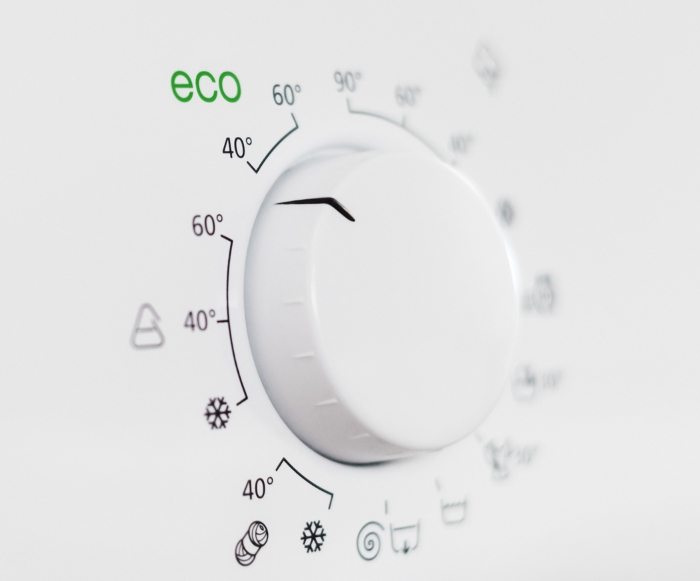 a washing machine dial showing temperatures and eco mode