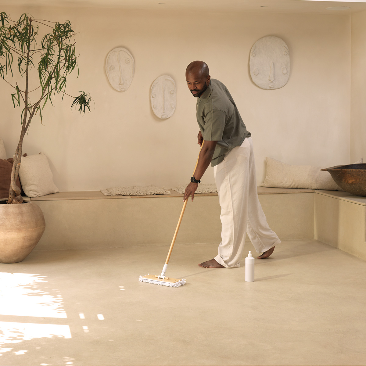 Man mops floor with Floor Reset
