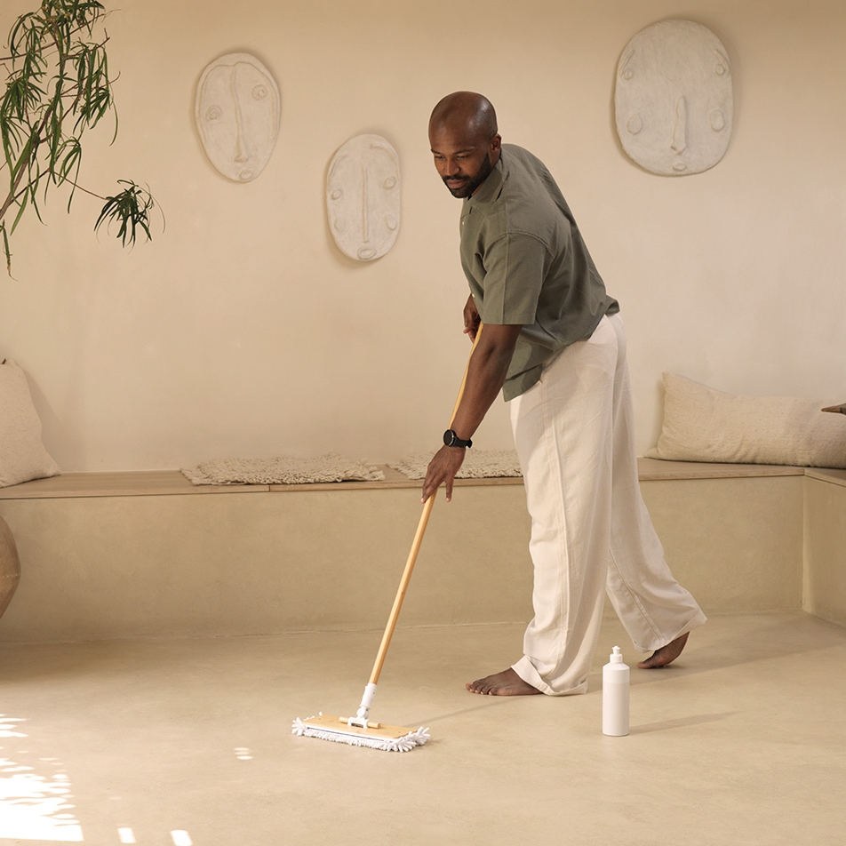 Man mops floor with Floor Reset