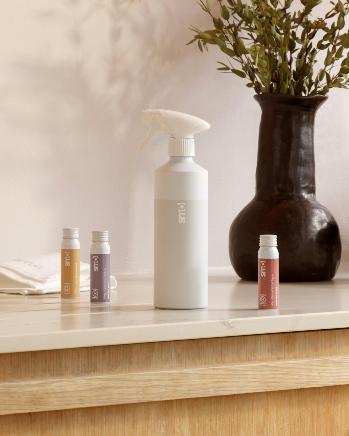 smol Surface Clean bottle-for-life and 3 refills on a counter