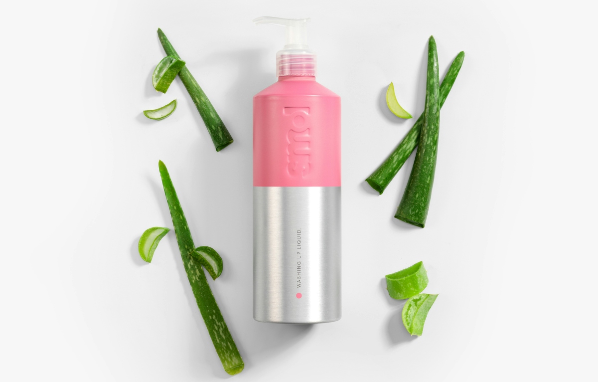 aluminium washing up bottle surrounded by aloe vera