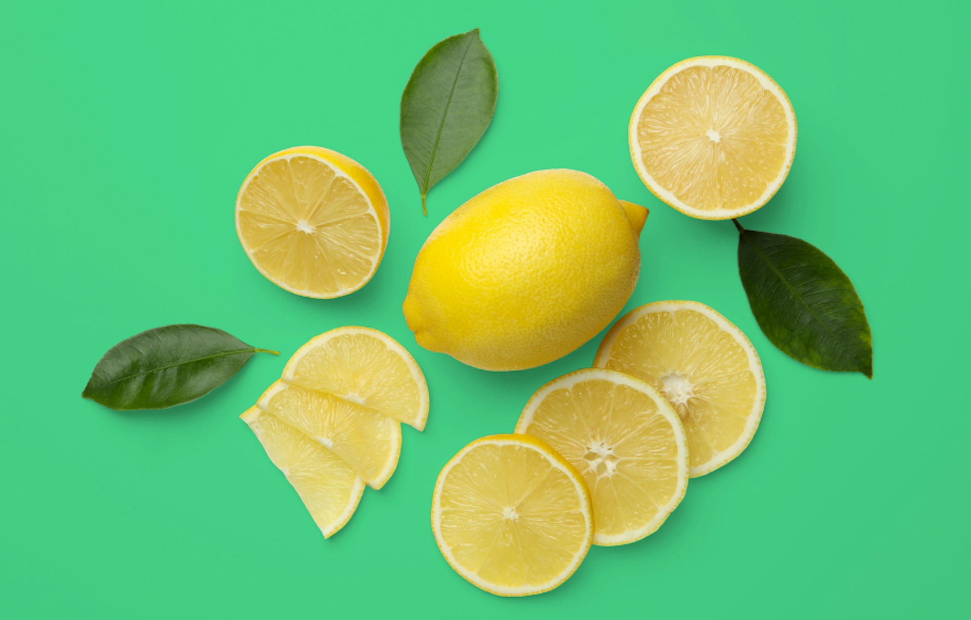 slices of lemon on a green background